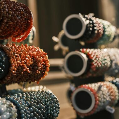 Colorful handmade beaded bracelets on display, highlighting their intricate design and vivid colors.