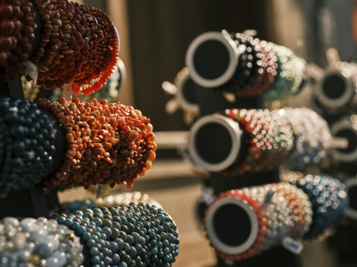 Colorful handmade beaded bracelets on display, highlighting their intricate design and vivid colors.